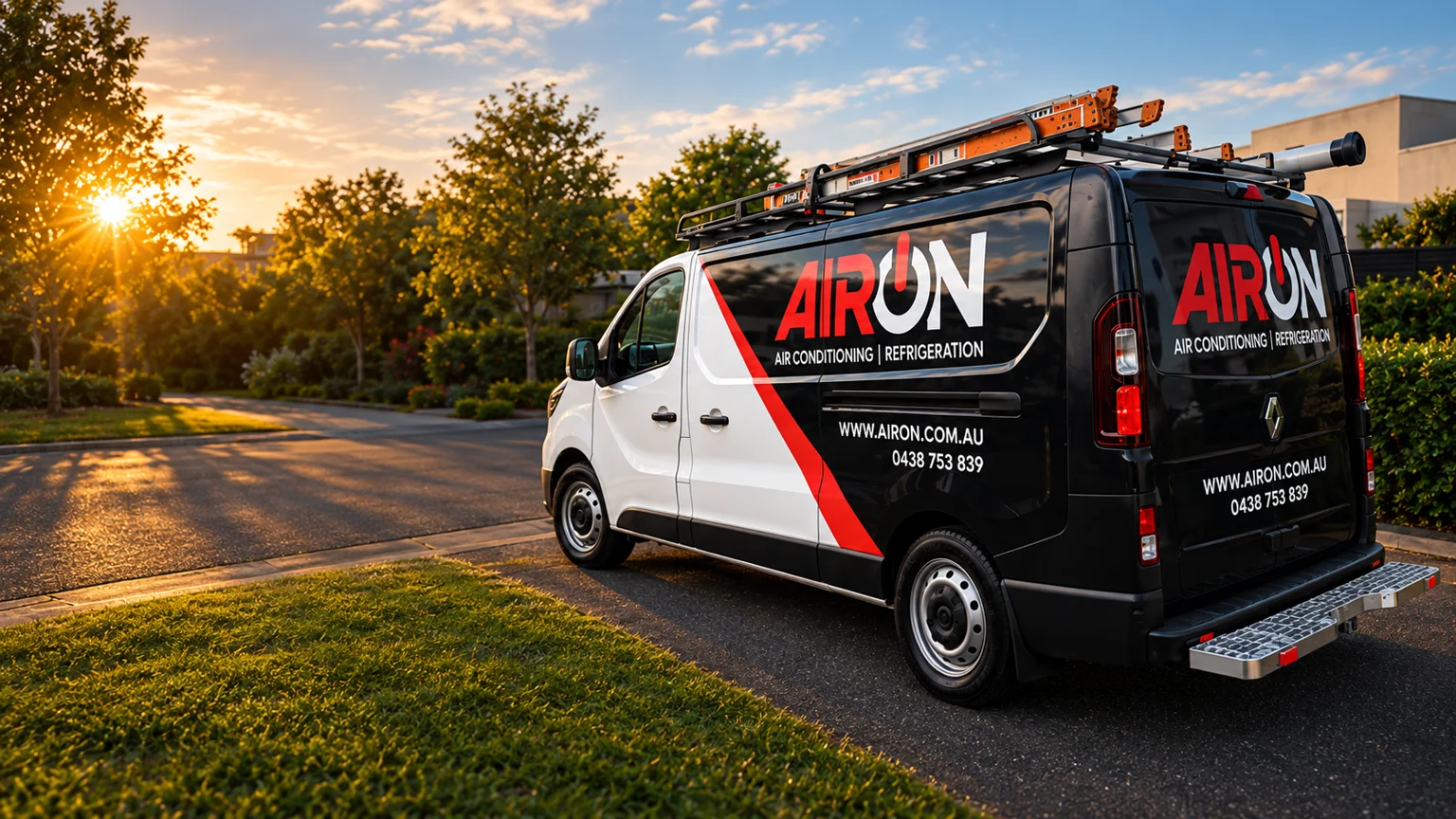 AIRON branded work van on a suburban street at sunset